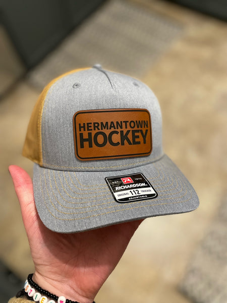Fund A Hawk Hermantown Hockey Leather Patch Hat
